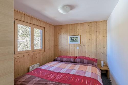 Postel nebo postele na pokoji v ubytování Chalet Krokus