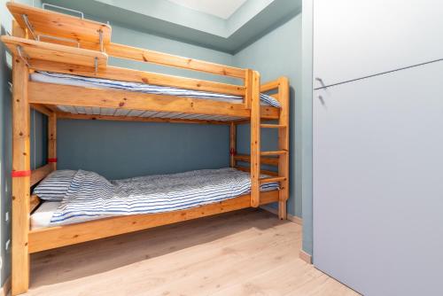 Postel nebo postele na pokoji v ubytování Appartement met zwembad in Neoportus Nieuwpoort