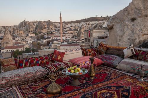 a living room with a view of a city at Zara Cave Hotel in Goreme