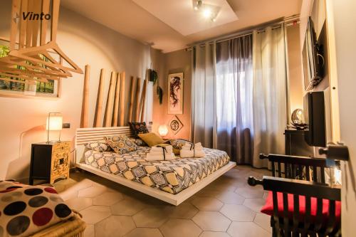 Ένα ή περισσότερα κρεβάτια σε δωμάτιο στο Vinto House Salerno Downtown