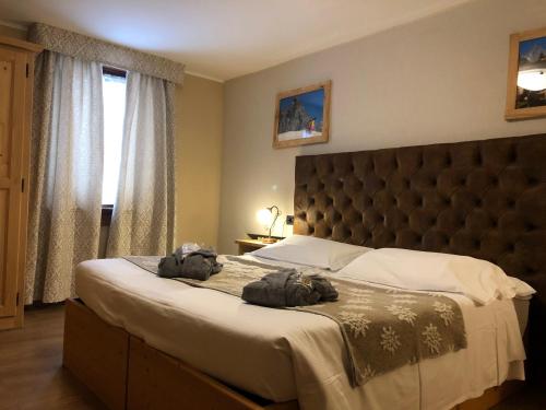 Postel nebo postele na pokoji v ubytování Hotel Edelweiss 3 Stelle SUPERIOR