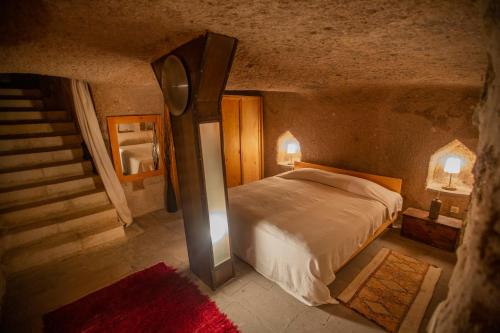 Ένα ή περισσότερα κρεβάτια σε δωμάτιο στο Asmalı Cave House
