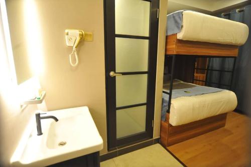 Ένα ή περισσότερα κρεβάτια σε δωμάτιο στο Skye Hotel Sunway