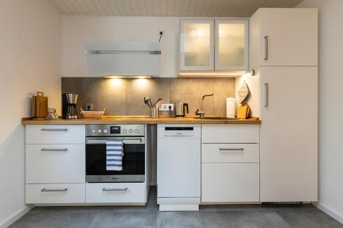 Dapur atau dapur kecil di Villa Duck-Dich-Südheide