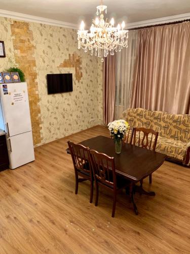 a living room with a table and a couch at Apartment on Zhukovskogo in Odesa