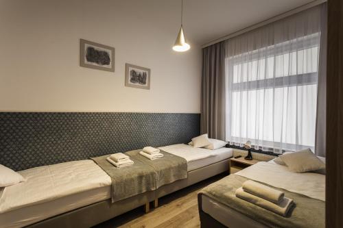 Кровать или кровати в номере Na Rozdrożu