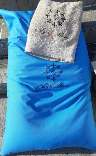 a blue pillow with a snowflake on it at Villa Sky Music in Obzor