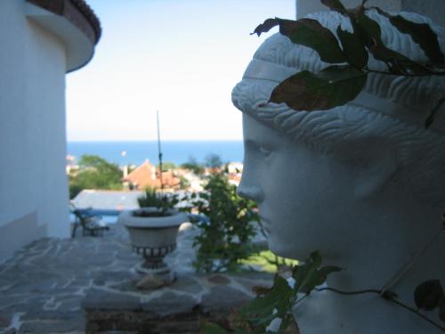 a statue of a bust of a head on a building at Villa Sky Music in Obzor