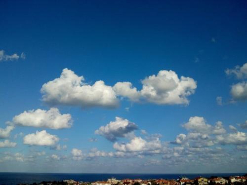 a group of white clouds in a blue sky at Villa Sky Music in Obzor