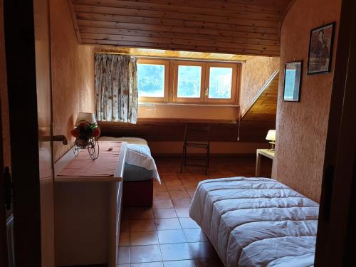a bedroom with a bed and a window in a room at LOFT PRIMAVERA in Roccaraso