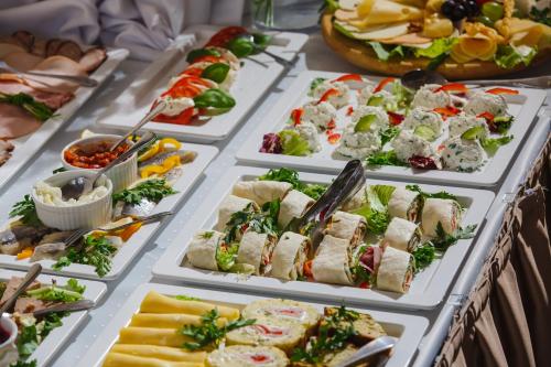 a buffet with many different types of food at Hotel Kantoria in Tarnów