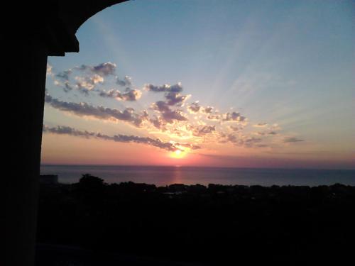 a sunset over the ocean with the sun in the sky at Villa Sky Music in Obzor