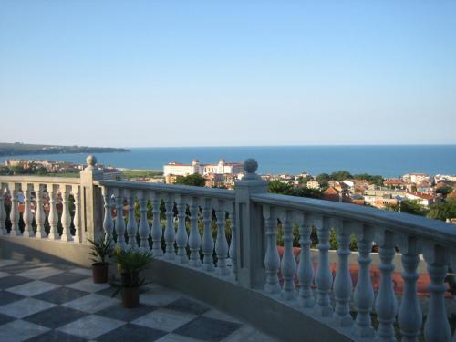 a white balcony with a view of the ocean at Villa Sky Music in Obzor