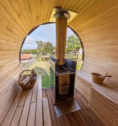 an inside view of a sauna with an open window at Osada Ulnowo - Holliday & Party House in Grunwald