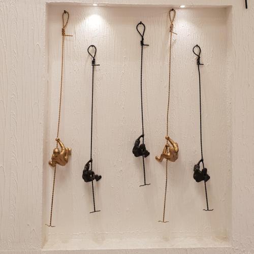 a group of hooks hanging on a wall at Hotel surya dev residency in Bengaluru