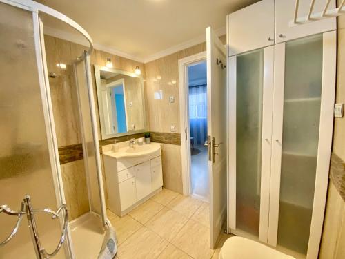 a bathroom with a shower and a toilet and a sink at Apartamento beach house in Las Palmas de Gran Canaria