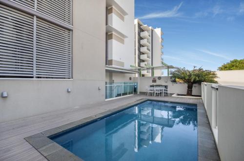 an image of a swimming pool in a house at Central Kensington Apartments in Townsville