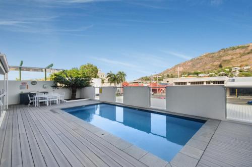 a swimming pool on the roof of a building at Central Kensington Apartments in Townsville