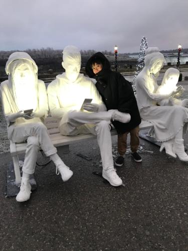 a group of people sitting on a bench at Maison Doucet in Niagara Falls