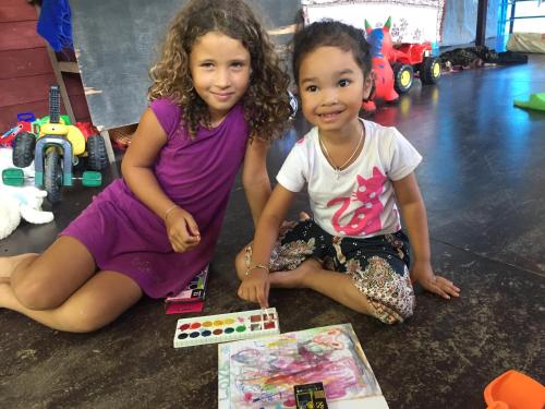 two young girls sitting on the floor with toys at Easylife Bungalow in Ko Lanta