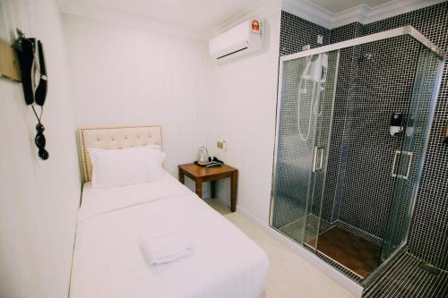 Ein Bett oder Betten in einem Zimmer der Unterkunft Hotel Venice