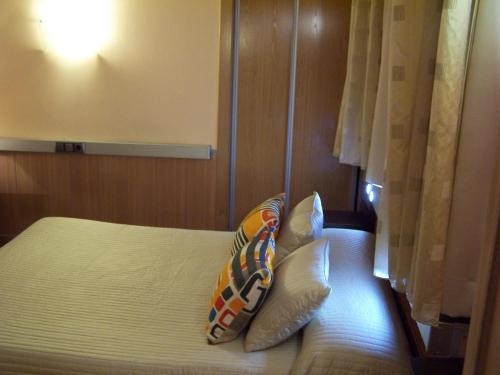 Katil atau katil-katil dalam bilik di Hostal El Carmen