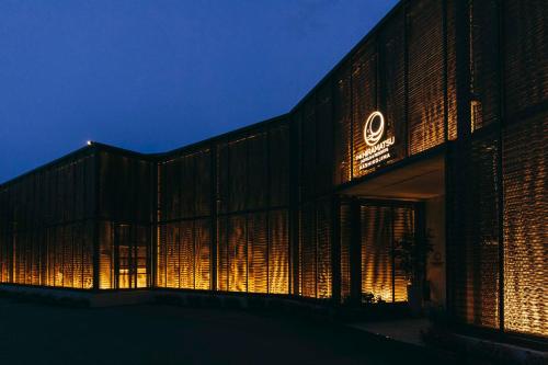 a building with a lit up facade at night at THE HIRAMATSU HOTELS & RESORTS KASHIKOJIMA in Shima