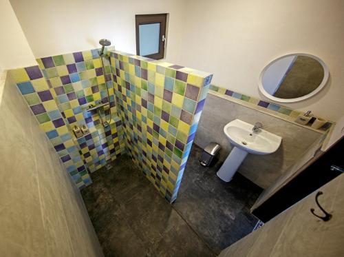 a bathroom with a sink and a mirror at Emoha Dive Resort in Oslob