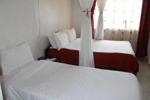 Ein Bett oder Betten in einem Zimmer der Unterkunft Salient Guest House