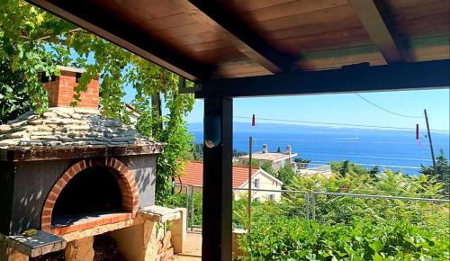 an outdoor oven with a view of the ocean at Marjan Hill in Split