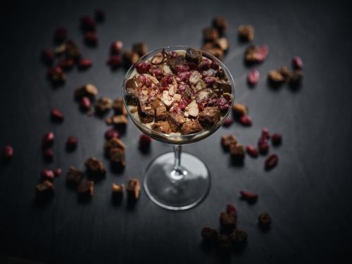 a wine glass filled with chocolate and nuts on a table at Contessina Suites & Spa - Adults Only in Tsilivi