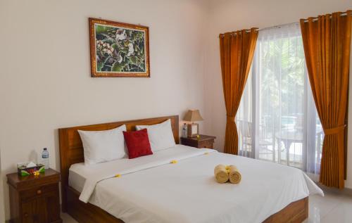 Ένα ή περισσότερα κρεβάτια σε δωμάτιο στο Tarzan Marriott On Penida