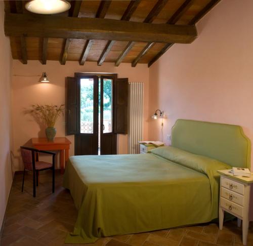 Säng eller sängar i ett rum på Borgo Le Capannelle
