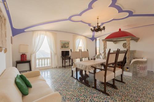 a living room with a couch and a table at Palazzo Compagna in Ravello
