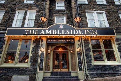 a building with a sign on the front of it at The Ambleside Inn in Ambleside