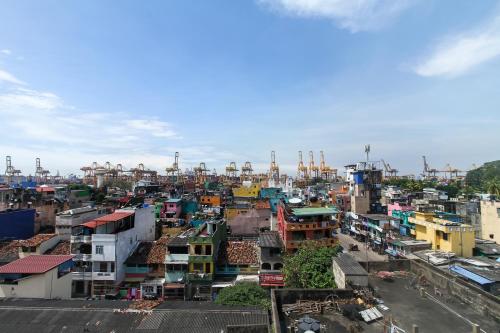 a view of a city with many buildings at Golden Pier City Hotel in Colombo