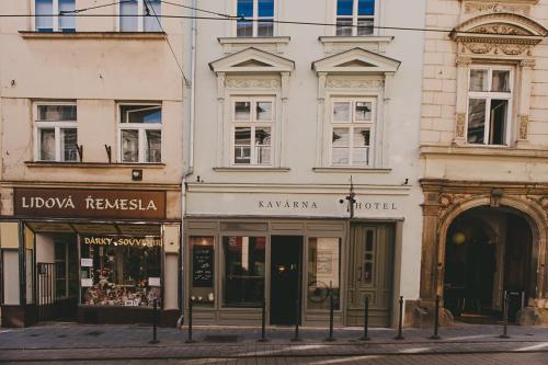 a row of buildings on a city street at Miss Sophie's Olomouc - Boutique Hotel in Olomouc