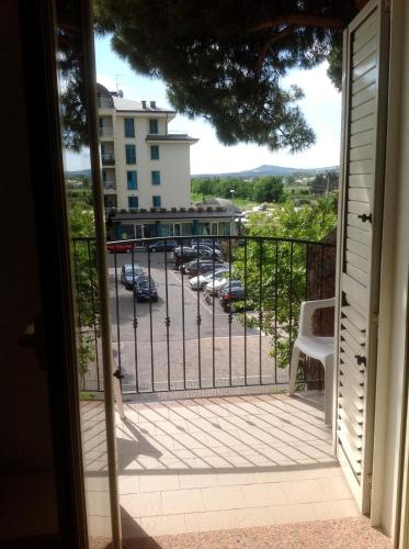 a balcony with a view of a parking lot at Hotel Serafini Misano Adriatico in Misano Adriatico