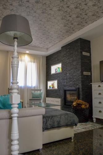 a bedroom with a bed and a fireplace at Casinha do Eido Novo - Alojamento Local in Valença