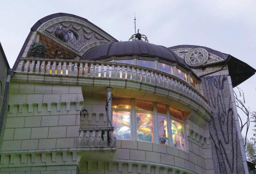 a building with a large window on top of it at Dali Apartments in Skopje