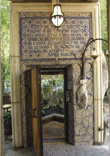 a door to a store with a sign on it at Dali Apartments in Skopje