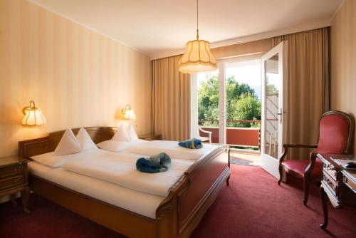 Tempat tidur dalam kamar di Dermuth Hotels – Hotel Sonnengrund