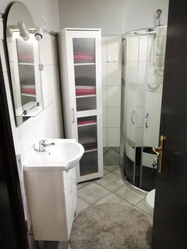 a bathroom with a sink and a shower at House Joel & Sonia with sea view in Funchal