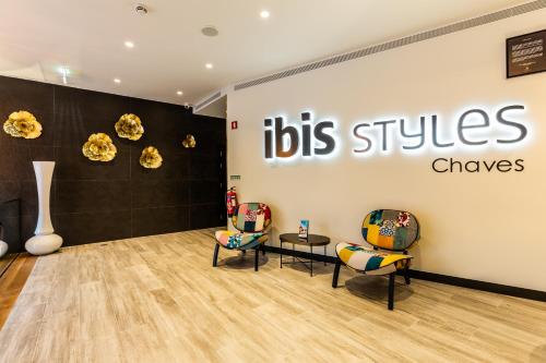 a store with chairs and a big sign on the wall at ibis Styles Chaves in Chaves