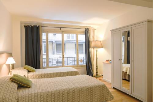 Кровать или кровати в номере Ponte Vecchio Large Apartment