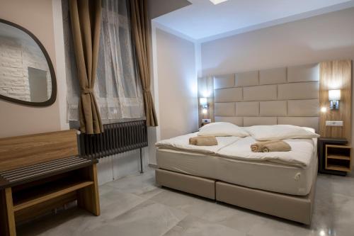 Llit o llits en una habitació de Hotel Restaurant Meteora