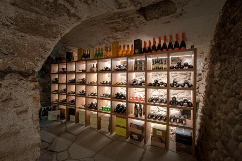 a room filled with lots of bottles of wine at Castel Hörtenberg in Bolzano