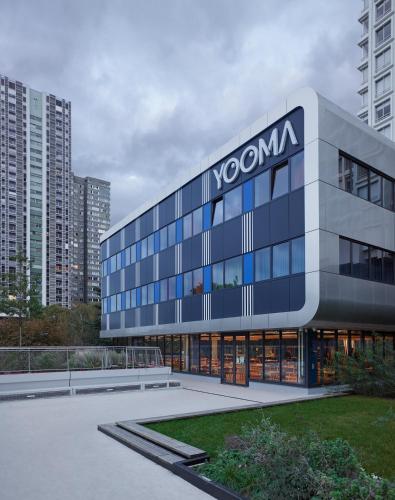 a building with a sign on the side of it at YOOMA Urban Lodge Tour Eiffel in Paris