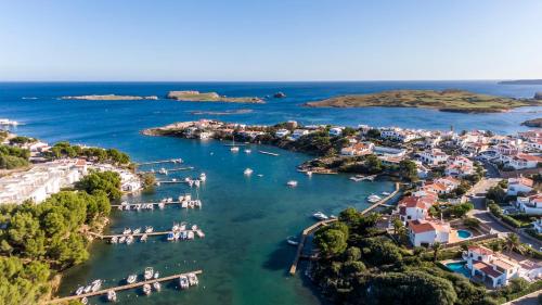 an aerial view of a harbor with boats in the water at Apartamento Addaia in Port d'Addaia