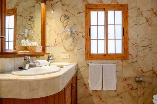 a bathroom with a sink and a mirror at Lantia Rooftop House in Arrecife